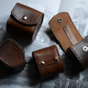 Estuche de cuero para accesorios de cámara, película, batería, fotómetro, etc.