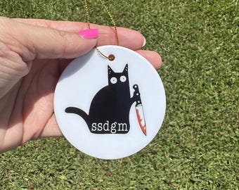 SSDGM Ceramic Ornament | True Crime Fan | Stay Sexy Don't Get Murdered Inspired | Black Cat with Knife Christmas Ornament | 2.75 Inch