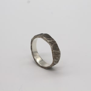 Brutalist silver ring with an iceberg texture