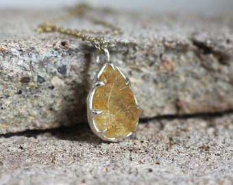 Rutiled quartz pendant with silver chain