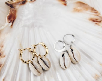 Stainless steel hoop earrings with natural cowrie shell