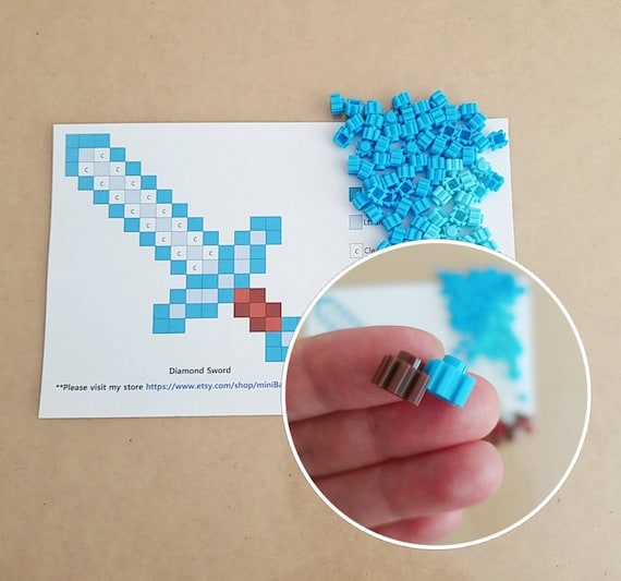 STL file A minecraft sword for your keychain in pixel style