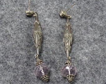 E 32 is a long pair of earrings made of sterling and amethyst beads