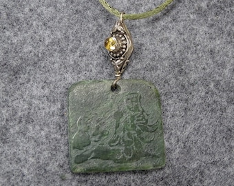 Carved jade pendant