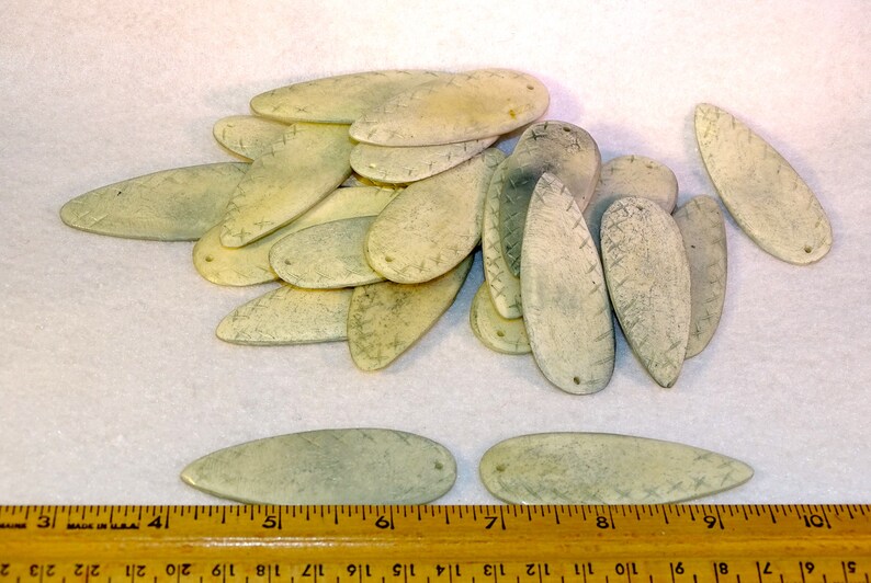 Carved bone pieces suitable for pendants and other decorative items
