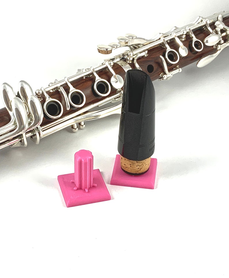 Clarinet mouthpiece display and drying stand hot pink