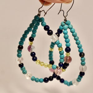 Dangle and drop earrings in blue colour with precious and semi-precious Myanmar stones
