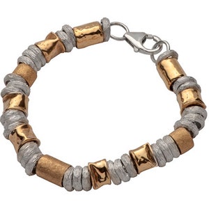 May include: A silver and gold beaded bracelet with a clasp closure. The beads are made of twisted metal and have a hammered texture.