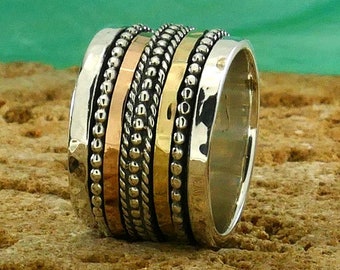 Bold Spin: Wide Two-Tone Statement Spinner Ring