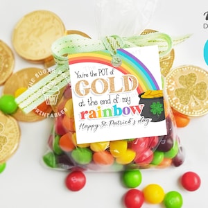 May include: A clear plastic bag filled with colorful candy, tied with a green ribbon and a tag that reads "You're the POT of GOLD at the end of my rainbow Happy St. Patrick's day".