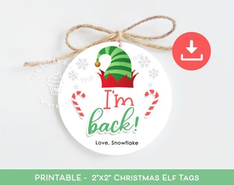 May include: Printable Christmas elf tag with a green elf hat, red candy canes, and the text "I'm back! Love, Snowflake".