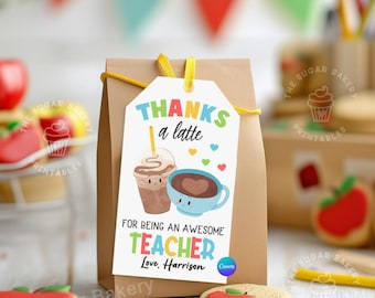 May include: A brown paper gift bag with a tag that says "THANKS a latte" with illustrations of a coffee drink and a blue coffee cup. The tag also reads "FOR BEING AN AWESOME TEACHER Love, Harrison". The background includes cookies and pencils.