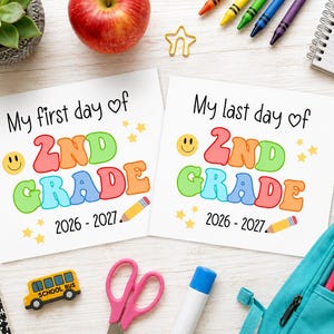 May include: Two white square signs featuring colourful bubble lettering. One reads My first day of 2nd Grade 2026-2027, the other My last day of 2nd Grade 2026-2027. Both include a yellow smiley face, small stars, and a yellow pencil graphic.