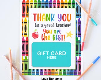 May include: A colorful thank you card for a teacher with a gift card space. The card features a border of crayons and the text "Thank you to a great teacher! You are the best!" with an apple and a star. The card also includes the text "Gift Card Here" and "Love Benjamin".