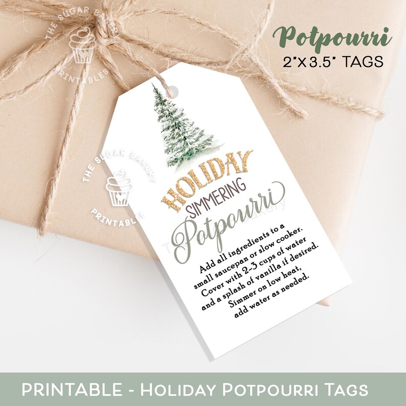 May include: Printable holiday potpourri tags with a gold glitter design. The tags feature a watercolor illustration of a pine tree and the text "Holiday Simmering Potpourri". Instructions for making the potpourri are included on the tag.
