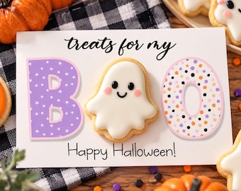 May include: A rectangular white card featuring the text treats for my in black script and Happy Halloween! in black print. The letter B is purple with white stars, the letter O is a white ghost cookie, and the letter O is white with polka dots.