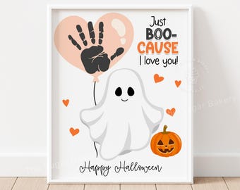 May include: A framed Halloween print featuring a cartoon ghost holding a balloon with a handprint. The text reads "Just BOO-CAUSE I love you!" with orange hearts and a jack-o'-lantern. The words "Happy Halloween" are at the bottom.