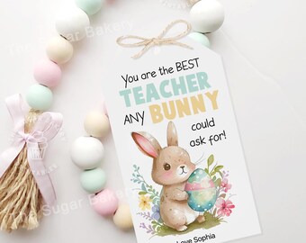 May include: A white card with a colorful illustration of a bunny holding an Easter egg. The card reads "You are the BEST TEACHER ANY BUNNY could ask for!" and is signed "Love Sophia".
