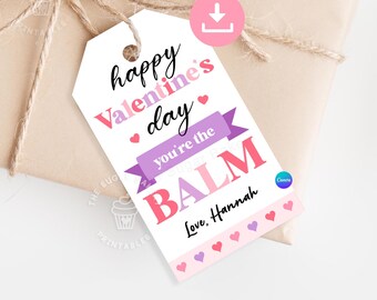 May include: A white printable Valentine's Day gift tag with pink and purple hearts and text that reads "happy Valentine's day you're the BALM Love, Hannah".