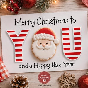 May include: A white rectangular card featuring the black text Merry Christmas to YOU and a Happy New Year. The letter Y and the letter U are decorated with red and white horizontal stripes, while a Santa Claus cookie replaces the letter O.
