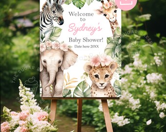 May include: A printable baby shower welcome sign with a jungle theme. The sign features a zebra, giraffe, elephant, and leopard with floral headbands. The text on the sign reads "Welcome to Sydney's Baby Shower! Date here 20XX".