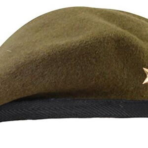 May include: A green beret with a black band and a gold star badge.