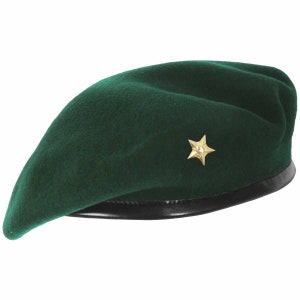 May include: A dark green beret with a gold star badge. The beret has a black leather band around the bottom.