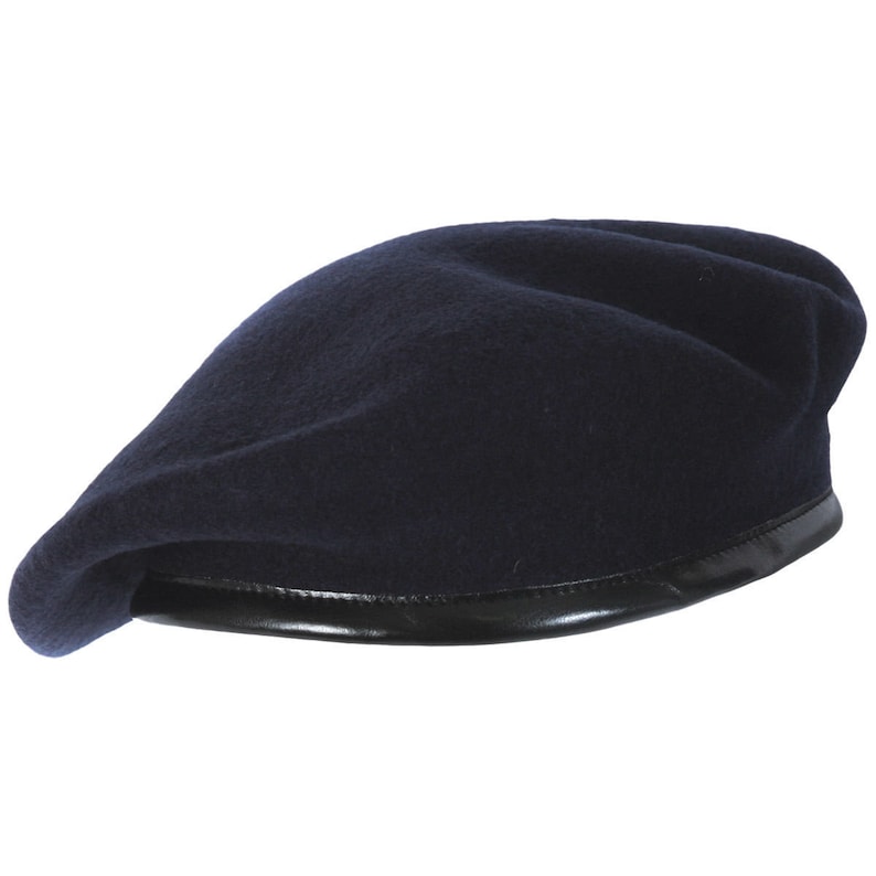 May include: A dark blue beret with a black leather band around the edge.