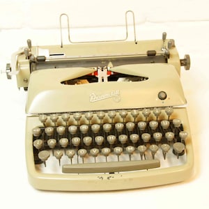 macchina da scrivere d&#39;epoca Rheinmetall (tw15), ca. anni &#39;50, con custodia originale, con nastro, perfettamente funzionante!