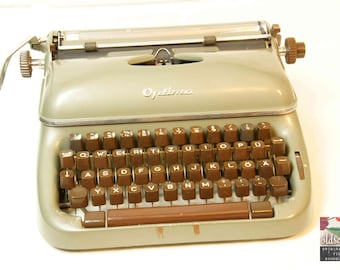 vintage typewriter  OPTIMA ELITE 3  green metallic (tw23), 1958, with original case, with ribbon, fully functional!