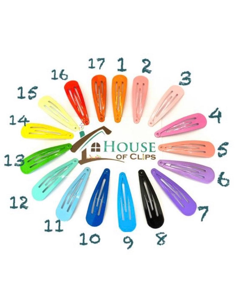 May include: A set of 17 colorful hair clips arranged in a circle. The clips are all the same size and shape, and they are made of metal. The clips are in a variety of colors, including red, orange, yellow, green, blue, purple, and pink. The text "HOUSE OF CLIPS" is in the center of the circle.
