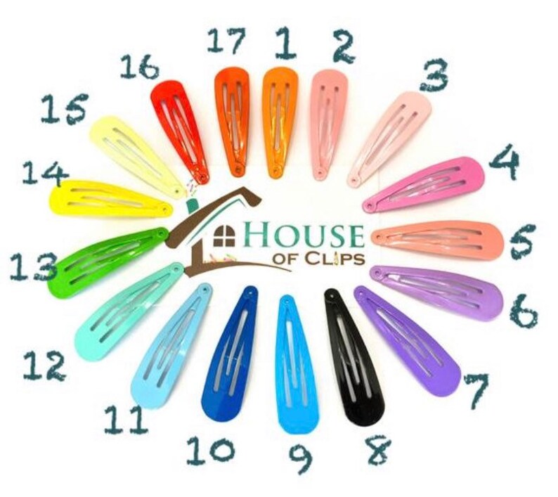 K&ouml;nnte beinhalten: Ein Satz von 17 bunten Haarklammern, die in einem Kreis angeordnet sind. Die Klammern sind von 1 bis 17 nummeriert. Der Text "HOUSE OF CLIPS" befindet sich in der Mitte des Kreises.