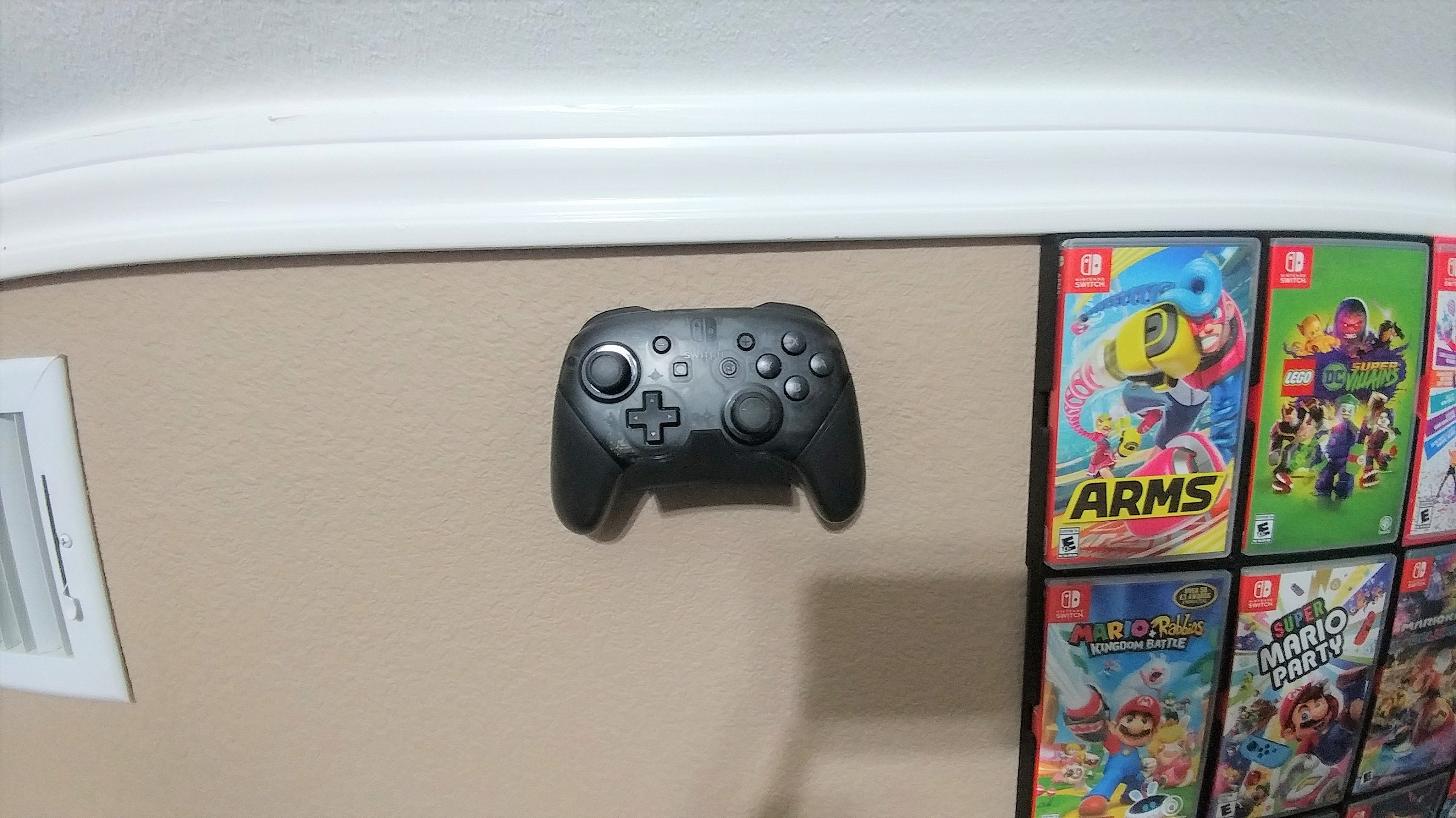 Soporte y soporte de pared para el mando profesional de Nintendo Switch