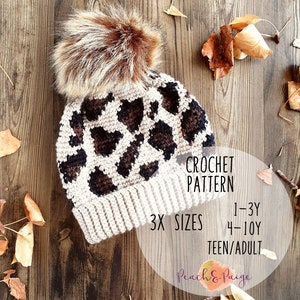 May include: Crochet pattern for a leopard print beanie hat with a faux fur pom pom. The pattern includes three sizes: 1-3 years, 4-10 years, and teen/adult. The pattern is available from Peach & Paige.