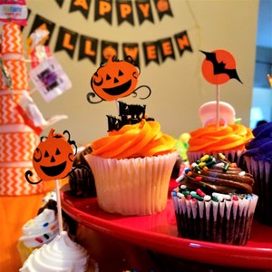 Halloween cupcake toppers featuring cute smiling pumpkins and bold black bats. The pumpkins are orange with a black background. While the bats are black flying over an orange moon. A perfect addition to a Halloween dessert table.