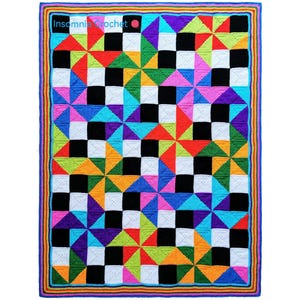 May include: A colorful, handmade crochet blanket with a geometric pattern. The blanket features squares of black, white, and various bright colors like red, green, blue, and purple. The border is a mix of rainbow colors. The text "Insomnia Crochet" is visible in the top left corner.