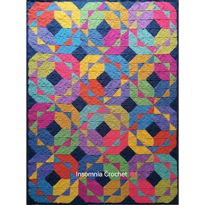 May include: A colorful crochet blanket with a geometric pattern in shades of blue, green, yellow, orange, pink, and purple. The blanket is made up of squares with a repeating pattern of triangles and circles. The blanket is made by Insomnia Crochet.