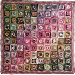 May include: A square crochet blanket composed of numerous individual granny squares arranged in a gradient pattern. The colors transition from deep forest greens and browns in the top left corner to vibrant pinks, purples, and soft creams throughout.
