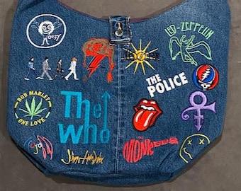 Embroidered Rock Music Crossbody Bag made from recycled jeans and lined with repurposed fabric. Two pockets inside, one zippered.