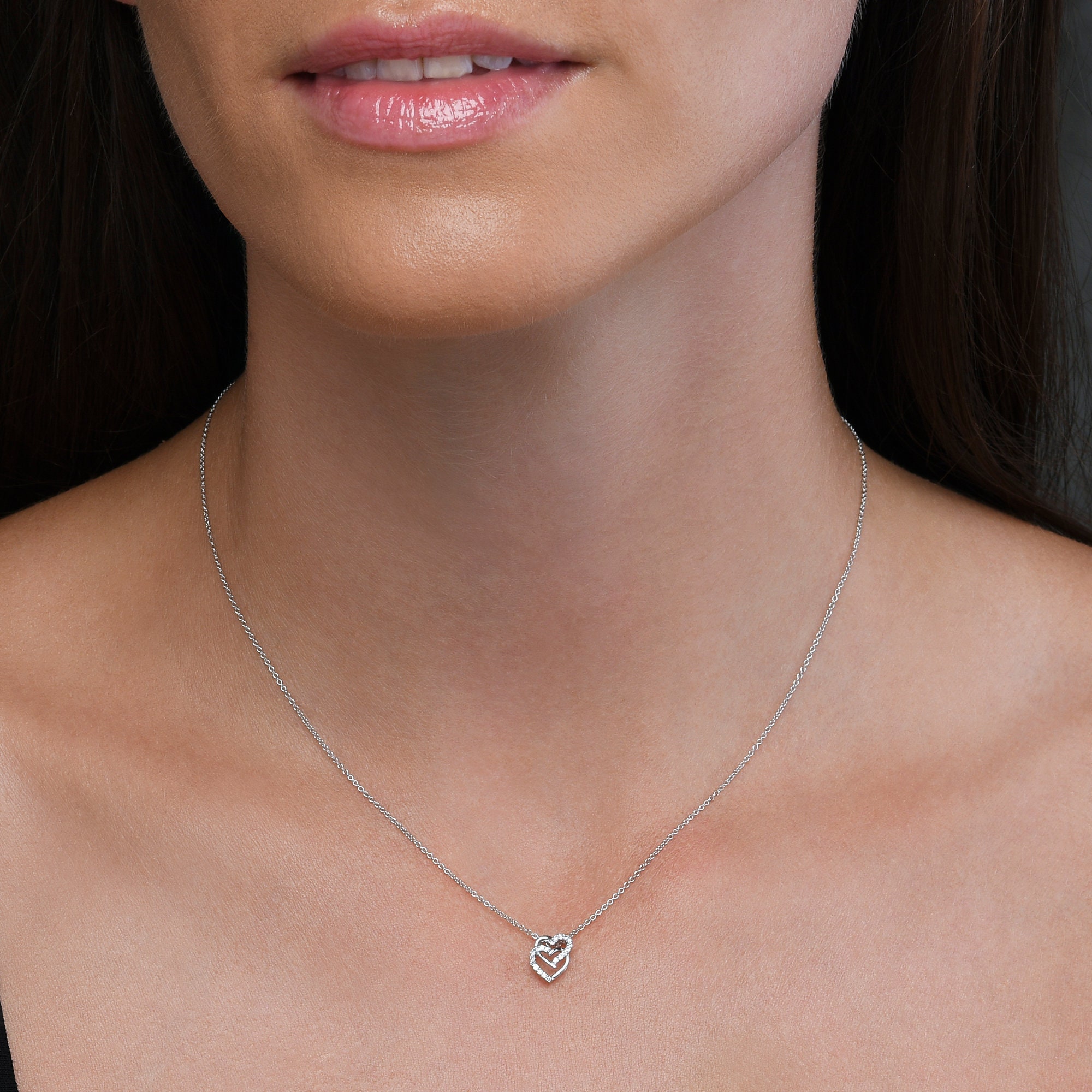 Pendentif en argent sterling en forme de cœur entrelacé avec diamants de 0.11 carat