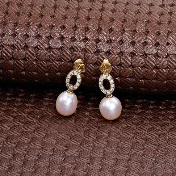Orecchini a bottone con nodo celtico in zirconia cubica a forma di cuore in oro 14 carati