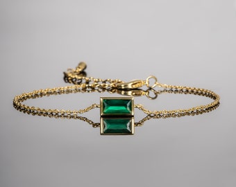 Gold bracelet with green best sale stone