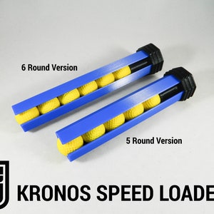 Op de afbeelding: Twee blauwe en zwarte speedloaders voor paintballs. De bovenste loader heeft ruimte voor 6 ballen en de onderste loader heeft ruimte voor 5 ballen.  "KRONOS SPEED LOADERS" staat onder de loaders gedrukt.