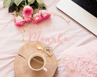 Styled Stock Photo.  Roses, laptop, notebooks and laptop in bed on pink sheets. Freelance fashion home femininity workspace in flat lay