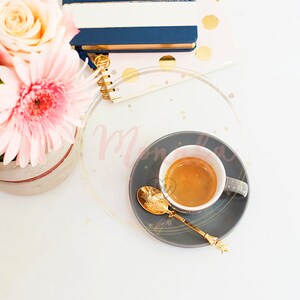 Styled Stock Photo. Feminine workplace concept in flat lay style with coffee, flowers, notebooks on marble background Top view pink and gold