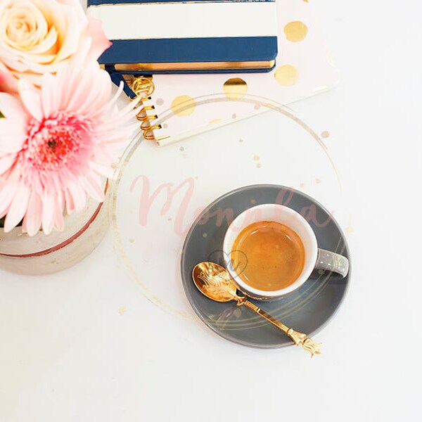 Styled Stock Photo. Feminine workplace concept in flat lay style with coffee, flowers, notebooks on marble background Top view pink and gold