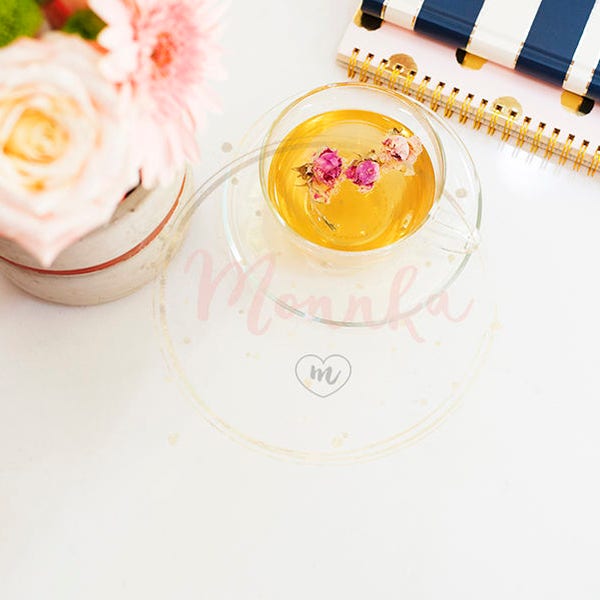 Styled Stock Photo.  A cup of healthy herbal tea & dried roses. Beautiful fresh flowers notebooks on light marble, top view Female work desk