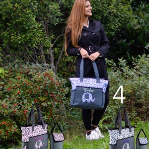 May include: Three gray and blue diaper bags with elephant designs and personalized names. The bags have multiple pockets and a changing pad. The bags are labeled with the numbers 3 and 4.