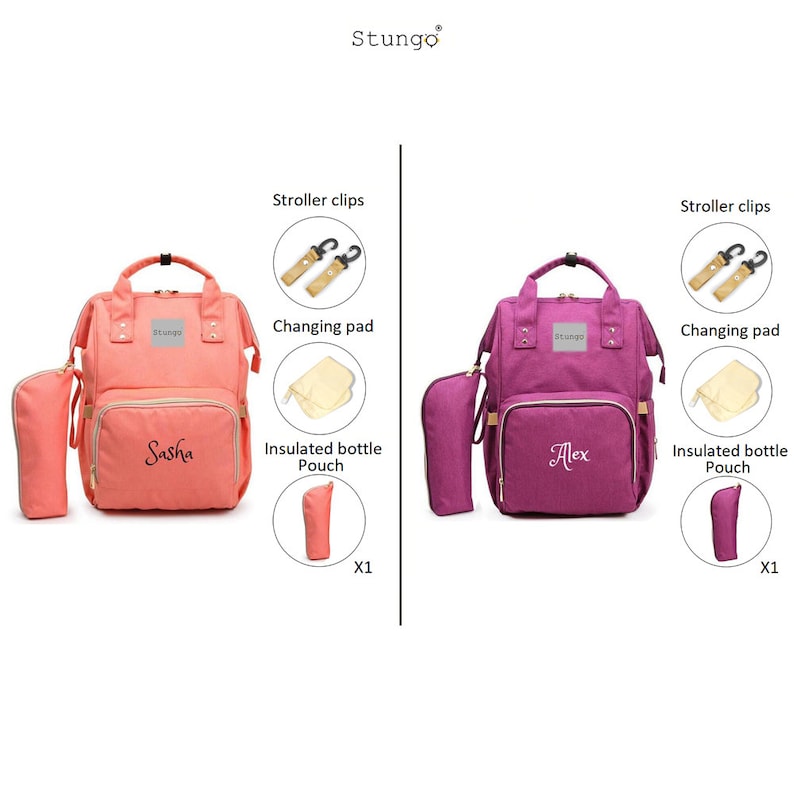 May include: Two diaper bags, one pink and one purple, with the names Sasha and Alex embroidered on them. Each bag comes with a changing pad, insulated bottle pouch, and stroller clips.