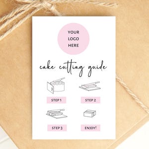 May include: A white cake cutting guide with a pink logo circle and illustrations for each step. The guide is on a brown paper background with twine.